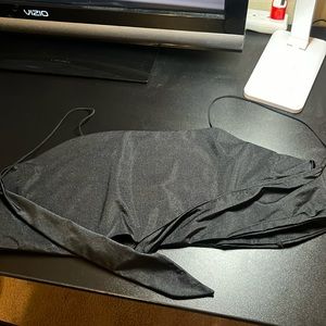 Silky material, thing straps with ties for the back, never worn!